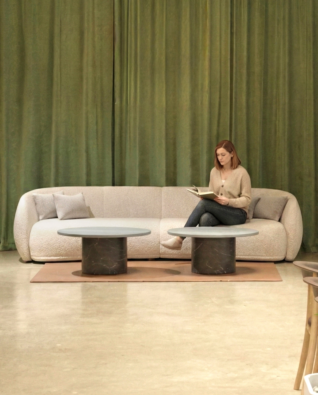 Comfortable lounge area with green curtains